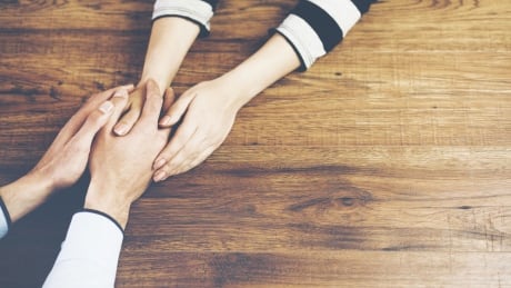 Holding hands across table