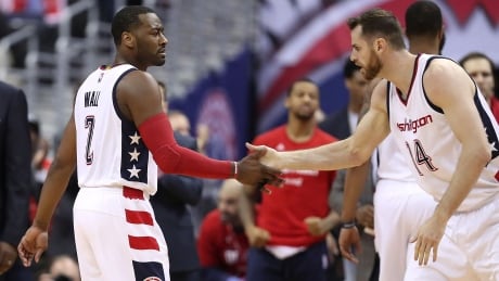 John Wall, left, scored 26 points, including the game-winning three-pointer, as the Washington Wizards forced a Game 7. john-wall