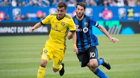 Montreal Impact's Ignacio Piatti, right, challenges Columbus Crew's Hector Jimenez during first half in Montreal on Saturday. impact-crew-051317-620