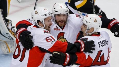 Ottawa Senators' Jean-Gabriel Pageau (44) celebrates with teammates Mark Stone (61) and Bobby Ryan (9) after scoring against the Pittsburgh Penguins during the first period. senators-penguins
