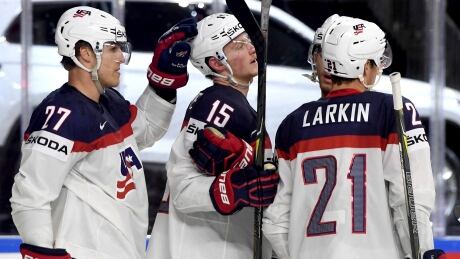 United States players celebrate during their Group A match, a 6-1 win over Slovakia, at the IIHF Hockey World Championship in Cologne, Germany on Sunday. united-states-hockey-worlds-051417-620