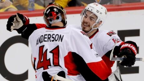 Ottawa Senators' Jean-Gabriel Pageau, right, celebrates with goalie Craig Anderson after defeating the Pittsburgh Penguins in the overtime period of Game 1. senators-penguins