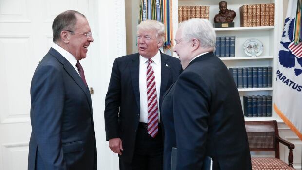 U.S. President Donald Trump speaks with Russian Foreign Minister Sergei Lavrov, left, and Russian Ambassador to the U.S. Sergei Kislyak at the White House on May 10. On Tuesday, after it was reported Trump revealed highly classified information, he tweeted he shared info for 'humanitarian reasons, plus I want Russia to greatly step up their fight against ISIS & terrorism.'