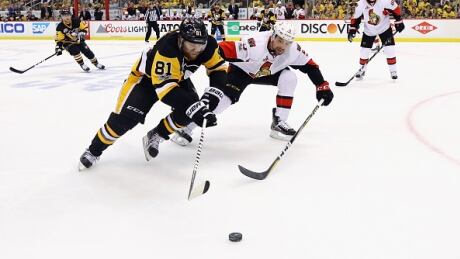 Pittsburgh Penguins' Phil Kessel skates against Ottawa Senators' Cody Ceci in Game 2 of the Eastern Conference final. kessel-phil