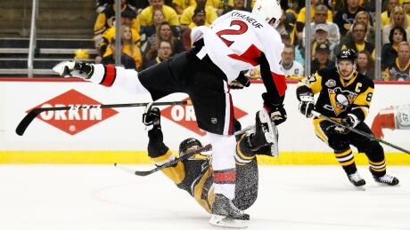 Dion Phaneuf hits Bryan Rust during the first period in Game 2 of the Eastern Conference final, forcing Rust to leave the game. phaneuf-rust-hit