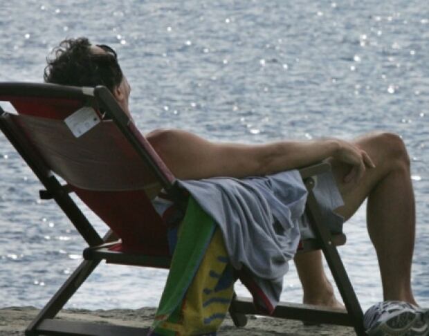 man sitting at a beach