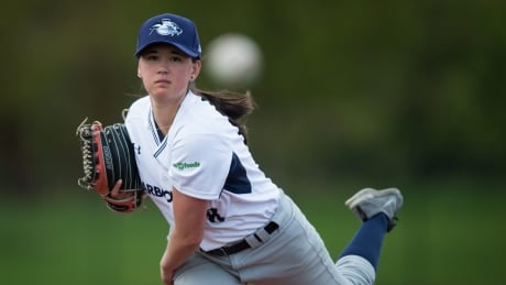 Claire Eccles, 19, pitches while posing for a photograph at UBC. The Victoria HarbourCats announced that Eccles will join the club for the 2017 West Coast League season. She will be the first woman to compete in the 11-team circuit. BBO Female Pitcher 20170516