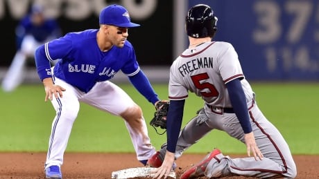 Atlanta's Freddie Freeman is tagged out at second base by Toronto's Devon Travis during the Braves' 9-5 win Tuesday. BBO Braves Blue Jays 20170516