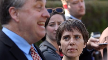 Deputy Leader of the B.C. Green party Sonia Furstenau looks on as B.C. Green party leader Andrew Weaver speaks to media. Green Party 20170517