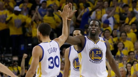 Golden State Warriors guard Stephen Curry, left, and forward Draymond Green celebrate during the second half of their Game 1 comeback against the San Antonio Spurs in the Western Conference final. The Warriors lead the series 2-0. curry-steph-green-draymond-051717