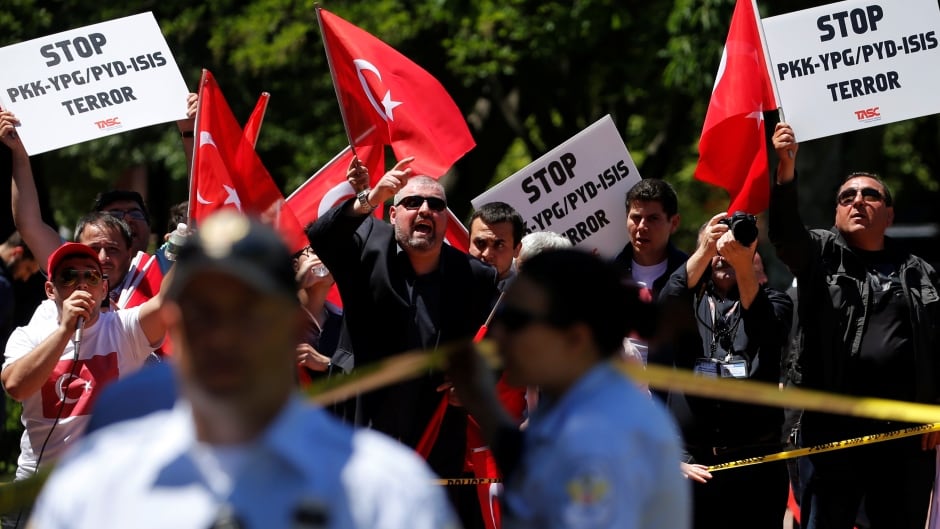 A group of pro-Erdogan demonstrators shout slogans at a group of anti-Erdogan Kurds in Lafayette Park on Wednesday. The day before, clashes between Erdogan supporters and anti-Erdogan protesters turned violent.