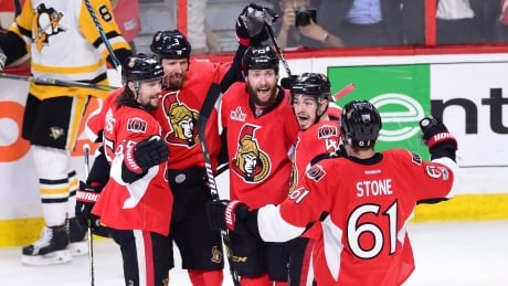 Ottawa Senators defenceman Erik Karlsson (65), defenceman Marc Methot (3), centre Zack Smith (15), centre Jean-Gabriel Pageau (44) and right wing Mark Stone (61) celebrate a goal against the Pittsburgh Penguins during the first period of Game 3. penguins-senators