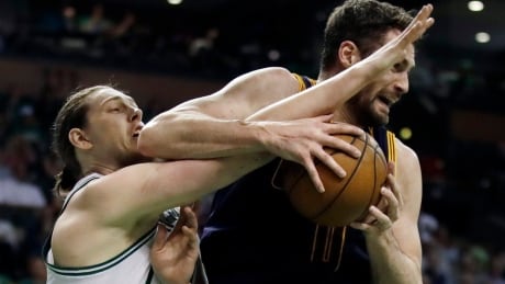 Boston's Kelly Olynyk fights Cleveland's Kevin Love for a rebound during the Cavaliers' 117-104 win in Game 1 of the Eastern Conference final Wednesday. Cavaliers Celtics Basketball