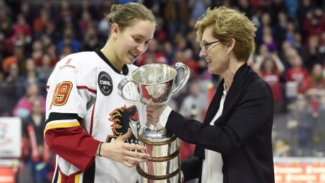 In this 2016 file photo, Canadian Women's Hockey League commissioner Brenda Andress presents Calgary Inferno captain Brianne Jenner with the Clarkson Cup. HKW Clarkson Cup 20160313
