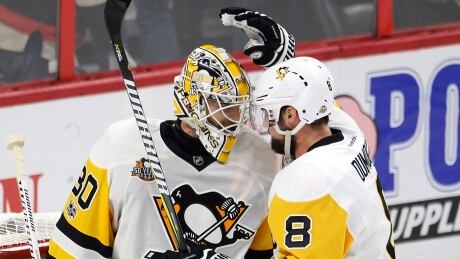 Brian Dumoulin, right, congratulates Matt Murray after defeating the Ottawa Senators 3-2 in Game 4 of the Eastern Conference final on Friday evening. matt-murray