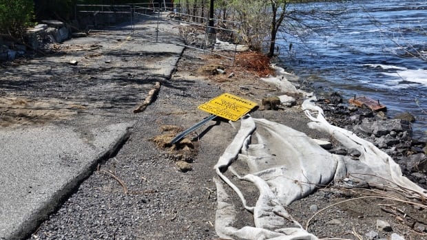 Knocked over sign and barricade washed out NCC path May 19, 2017