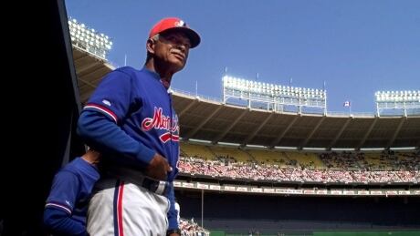 Montreal Expos manager Felipe Alou looks out of the dugout prior to a game against the St. Louis Cardinals, Saturday, April 3, 1999, at RFK Stadium in Washington. EXPOS CARDINALS