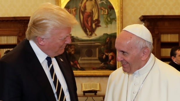 Pope Francis talks with U.S. President Donald Trump during a private audience at the Vatican. 