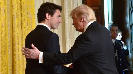 Prime Minister Justin Trudeau, left, and U.S. President Donald Trump shake hands after holding a joint news conference at the White House, in Washington, D.C., on Monday, Feb. 13, 2017. The Liberal government has delayed the release of its new defence policy, setting up a potentially awkward meeting between Trudeau and Trump next week. Defence Policy 20170515