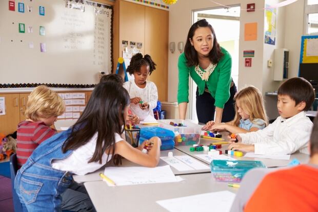 Teacher classroom elementary students school stock