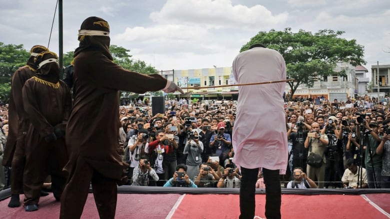 Sharia law - Woman whipped 26 times in Indonesia for having sex outside  marriage, World, News