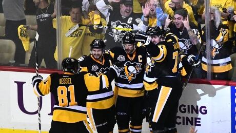 The Pittsburgh Penguins celebrate Justin Schultz's goal against the Ottawa Senators during Game 7 Monday. 700047966JH00069_Ottawa_Sen
