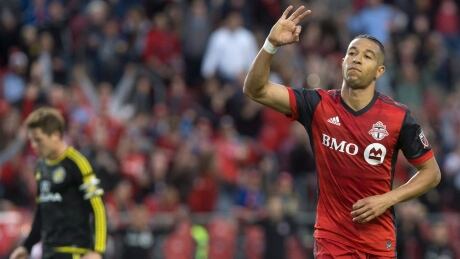Justin Morrow, right, celebrates scoring Toronto FC's second goal against the Columbus Crew during first half MLS action in Toronto on Friday evening. justin-morrow