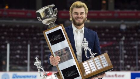 CHL Player of the Year Award recipient Alex DeBrincat, from the Erie Otters, holds his trophy following a media availability at the Memorial Cup Saturday in Windsor. Windsor will face the Erie Otters in the final of the Memorial Cup. HKO Memorial Cup 20170527