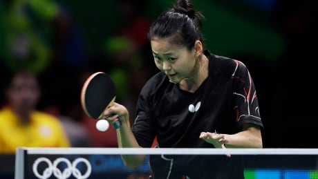 Mo Zhang of Canada plays against Georgina Pota of Hungary during their table tennis match at the 2016 Summer Olympics in Rio de Janeiro, Brazil, Saturday, Aug. 6, 2016.(AP Photo/Petros Giannakouris) Rio Olympics Table Tennis Women