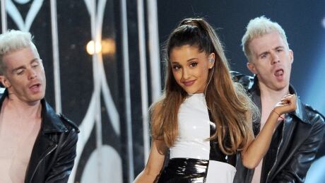 FILE - In this May 18, 2014 file photo, Ariana Grande performs at the Billboard Music Awards at the MGM Grand Garden Arena, in Las Vegas. Police in Lake Elsinore, California said in a statement Monday, July 13, 2015, that the owner of Wolfee Donuts, where Grande was videotaped licking doughnuts, declined to press charges against Grande. The 22-year-old singer said she was “disgusted” with herself and wanted to “disappear” after TMZ posted the video. People-Ariana Grande