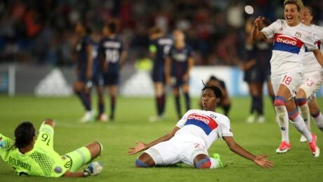 Kadeisha Buchanan, centre, celebrates after Lyon defeated Paris Saint-Germain 7-6 in a penalty shootout to win the Women's Champions League Final. kadeisha-buchanan