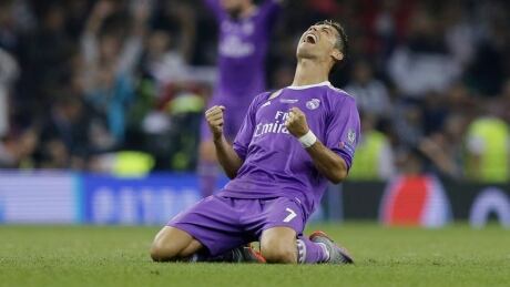 Cristiano Ronaldo celebrates after Real Madrid successfully defended its Champions League title. Ronaldo Soccer Champions League Final