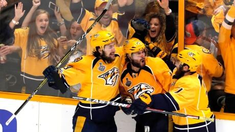 Nashville's Craig Smith, centre, celebrates with his teammates after scoring against Pittsburgh in Game 3 of the Stanley Cup final. Craig-Smith-Nashville-Predators-Game-3