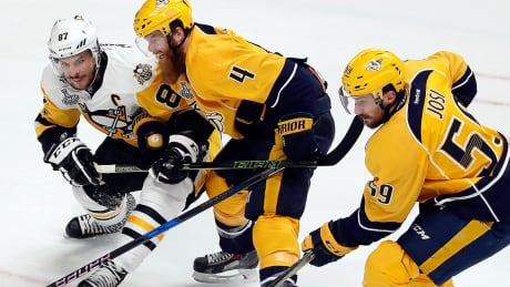 Roman Josi, right, and teammate Ryan Ellis, middle, lead the Predators defence in these Stanley Cup playoffs with 14 and 12 points, respectively, as Nashville is the third team in NHL history with four defencemen to reach double-digits in the same post-season. josi-roman-170603-1180