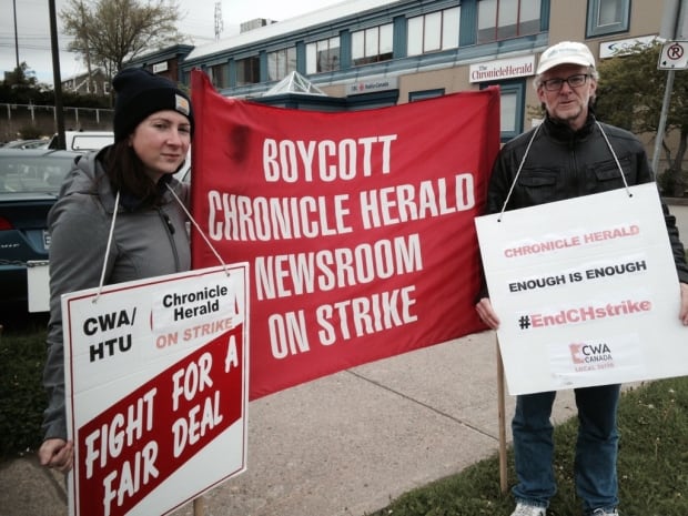 Striking Chronicle Herald reporters Erin Pottie, Tom Ayers