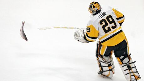 Penguins goalie Marc-Andre Fleury helped remove one of the five catfish that were thrown on the ice in Game 3. fleury-marc-andre-060517