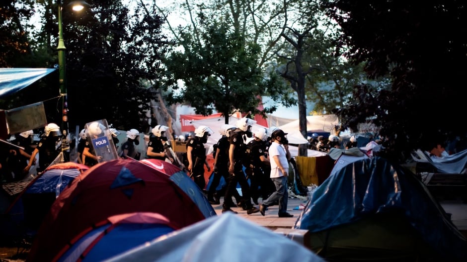 Turkish riot police dismantle the tent camp set up by demonstrators in Gezi Park in Istanbul on June 15, 2013.