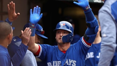 Toronto's Josh Donaldson celebrates his two-run home run in the 10th inning, giving the Jays a 7-5 win over Oakland Wednesday. donaldson-josh-070617