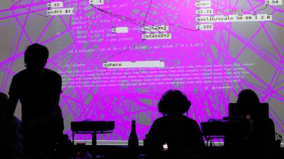 Musicians/coders perform at a live coding concert called an "algorave" (a portmanteau of algorithm and rave).