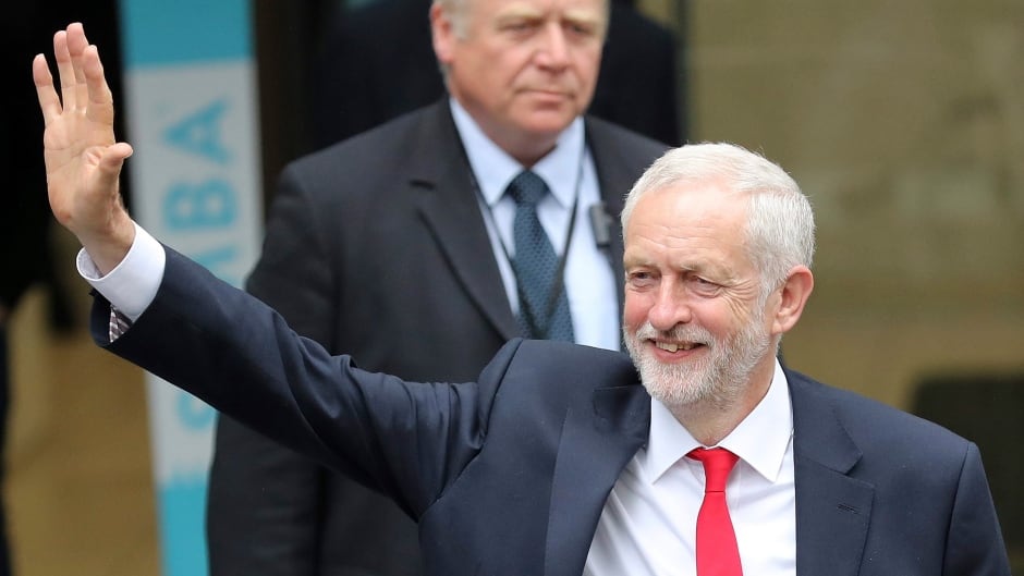 Britain's Labour party leader Jeremy Corbyn waves as he leaves the Labour party headquarters in London, Friday, June 9, 2017. (AP Photo/Tim Ireland)