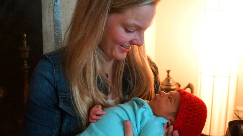 Baby staring adoringly at his mother.