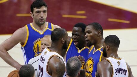 Cleveland Cavaliers forward LeBron James (23) argues with Golden State Warriors' Draymond Green (23) and Kevin Durant (35) during Game 4 of the NBA Finals in Cleveland on Friday. cavaliers-warriors-060917-620