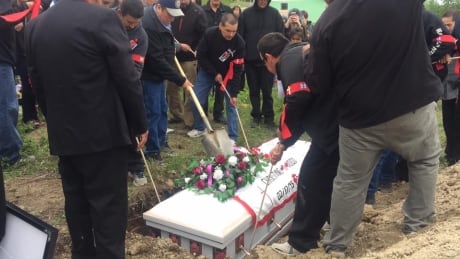 Christine Wood's casket was laid into the ground Saturday. Christine Wood's casket was laid into the ground Saturday.