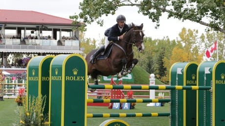 American Richard Spooner, pictured above with Cristallo at Spruce Meadows in 2015, won his third consecutive derby on Sunday with a rare clear round. spooner-richard