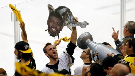 A Pittsburgh Penguins fan holds a catfish sign adorned with the face of Nashville Predators' P.K. Subban during the second period in Game 5 of the NHL hockey Stanley Cup Final, Thursday, June 8, 2017, in Pittsburgh. Stanley Cup Predators Penguins Hockey