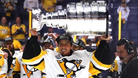 Marc-Andre Fleury raises the Stanley Cup after the Pittsburgh Penguins beat the Nashville Predators on Sunday. The veteran's future with the team is in doubt as he will likely be exposed in the June 21 expansion draft. 700056240MR00330_2017_NHL_S