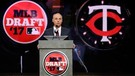 Commissioner Rob Manfred announces the Minnesota Twins selection of Royce Lewis, a shortstop and outfielder, with the No. 1 pick in the first round of the MLB draft. manfred-rob-061217