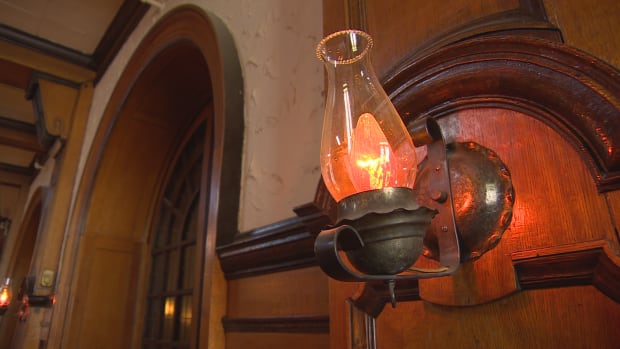 The windows are stained glass, and candelabras have been fitted with newfangled candle bulbs.