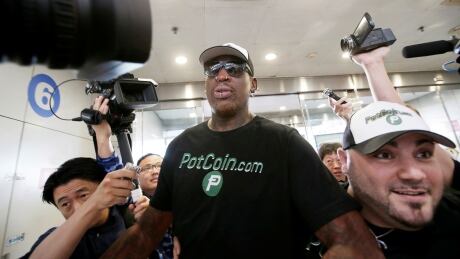 Former NBA basketball player Dennis Rodman speaks to the media as he leaves for North Korea's Pyongyang, at Beijing Capital International Airport, China, June 13, 2017. REUTERS/Jason Lee TPX IMAGES OF THE DAY - RTS16SSV USA-NORTHKOREA/RODMAN