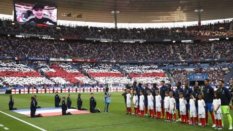 Members of Team France pay tribute to recent terror attacks in the U.K. prior to a friendly with England in Paris. 700047324MT00078_France_v_E